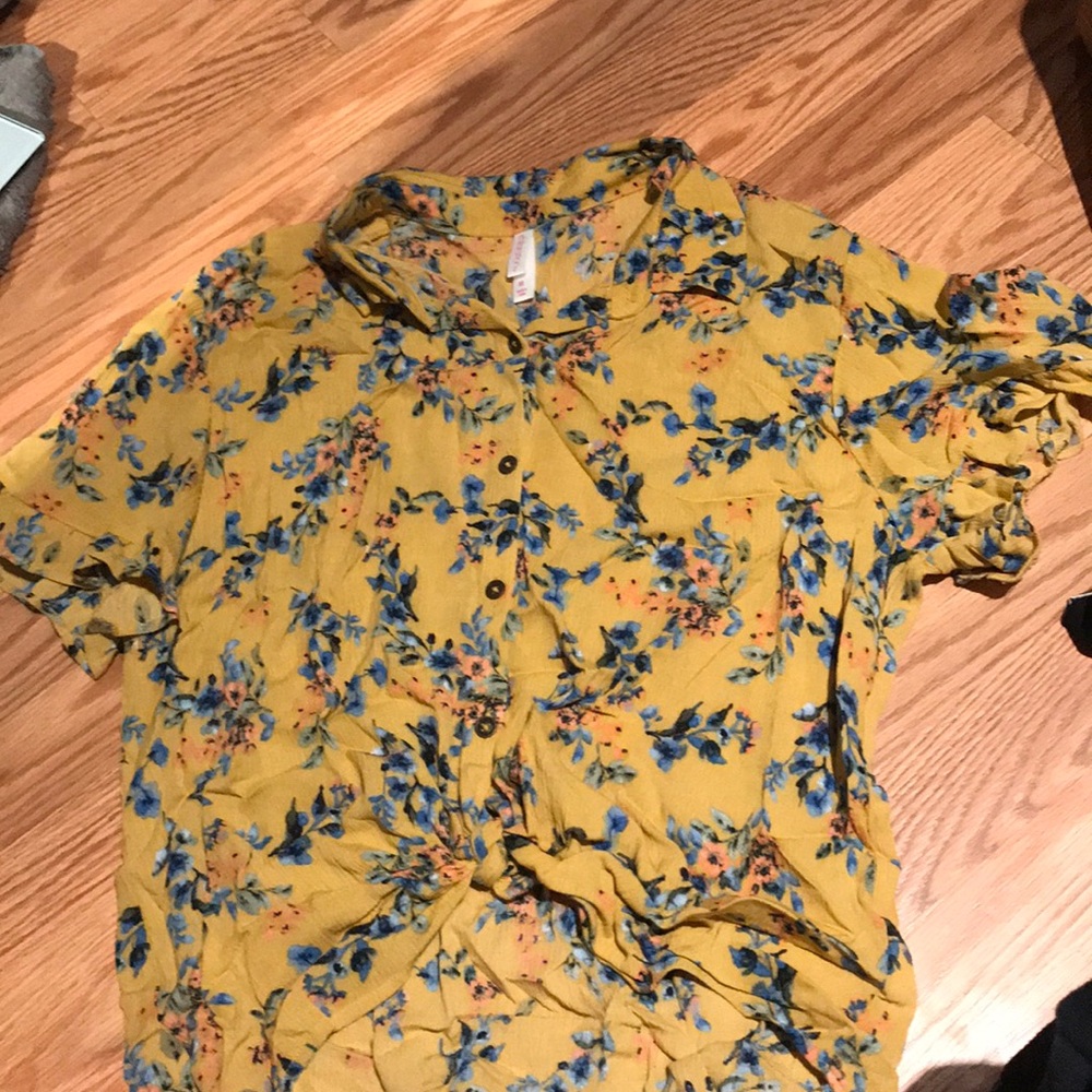 Yellow floral shirt with a tie in the lower front